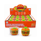 Burger fidget spinner ball with green button and orange bun details beside clear packaging and a 12-piece display